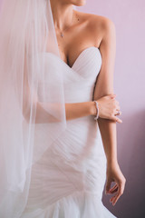 Beautiful bride with fashion wedding hairstyle. Closeup portrait of young gorgeous bride.