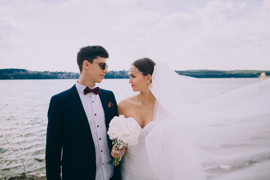 Elegant Young Bride And Groom On The Beach