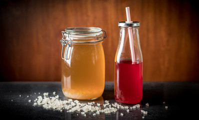 Fermenting water kefir and water kefir ready for drinking.