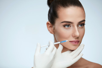 Plastic Surgery. Beautiful Woman Face Getting Beauty Injections