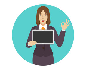 Businesswoman holding a digital tablet PC and showing a okay hand sign
