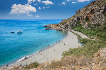 Preveli Beach in Crete island, Greece.  There is a palm forest and a river inside the gorge near this beach.
