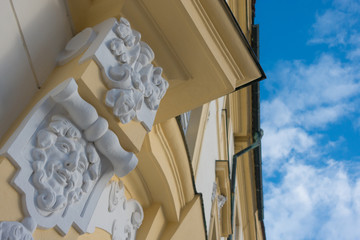 Obraz na płótnie Canvas Classical facade of a building and blue sky in Prague