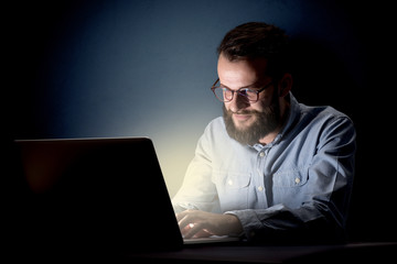 Businessman in the office at night