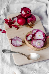 Spoon of health. Red onion