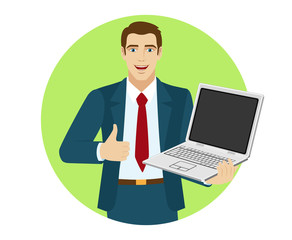Fototapeta na wymiar Businessman holding laptop notebook and showing the thumb up