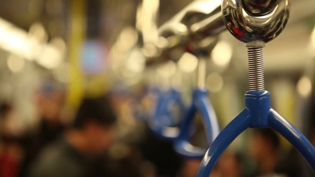 Close up of blye safety handler in the chinese metro.