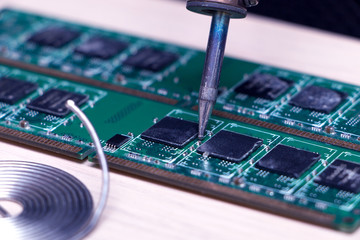 Board with chip soldering iron and rosin and solder