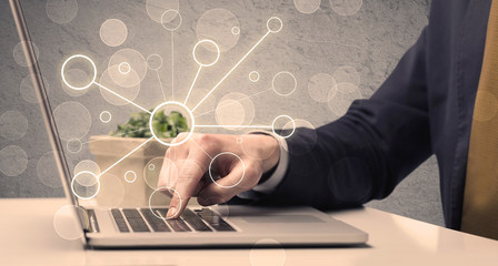 Science worker typing on laptop computer