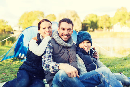 happy family with tent at camp site