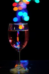 Fototapeta na wymiar wine glasses with light bokeh background.