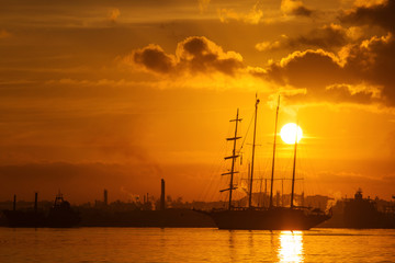 Sail boat at sunrise in Havana port, Cuba