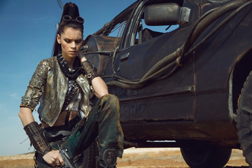 Woman warrior in futuristic clothes with car
