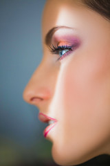 Side view face of young woman with makeup