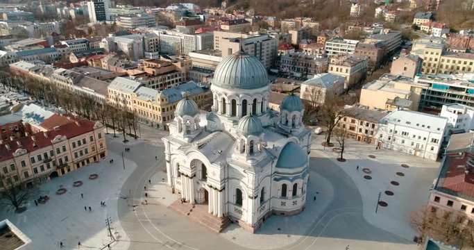 AERIAL. Point of interest (360) drone shot around St. Michael the Archangel Church (Soboras) in Kaunas, Liberty Boulevard, Lithuania. Sunny spring day. 4k