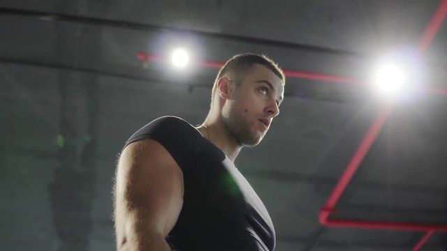 A young man is training in the gym. 4K