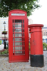 Red mailbox and telephone cell in London, Great Britain