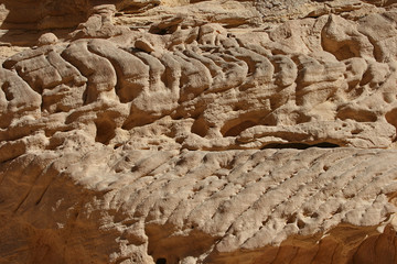 Fantastic patterns and traces of geological events on the walls colored canyon in Egypt.