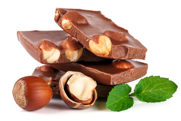Chocolate with hazelnut and mint leaf isolated on white background