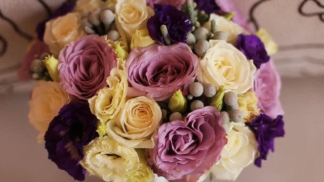 Beautiful wedding flower bouquet. Close up. Yellow, pink and purple bridal bouquet