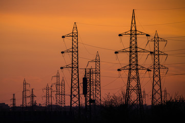 Silhouette of the electricity transmission pylon at sunset