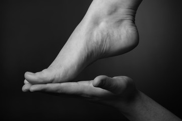 He and she. Close-up of a palm and a foot.