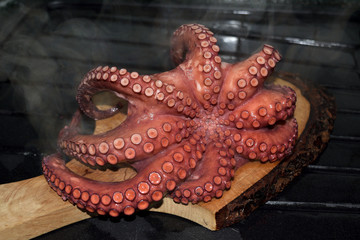 boiled octopus on cutting board ready to be cut
