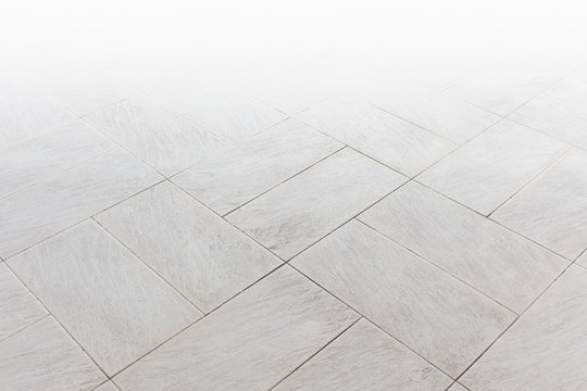 Stone pattern on tile floor with geometric line for background.