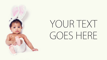 Lovely baby girl portrait sitting and wearing bunny ears, card