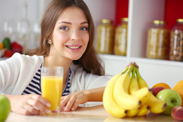 Portrait of a pretty woman holding glass with tasty juice