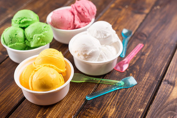 Colorful ice cream balls in cups.
