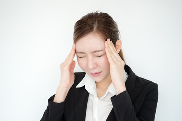 Young asian business woman headache  white background.  work hard tired concept.