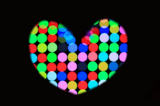 light in bokeh shape of a heart  in night beautiful, concept Valentine day background