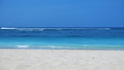 Beach background /A beach is a landform along a body of water. It usually consists of loose particles, which are often composed of rock, such as sand, gravel, shingle, pebbles