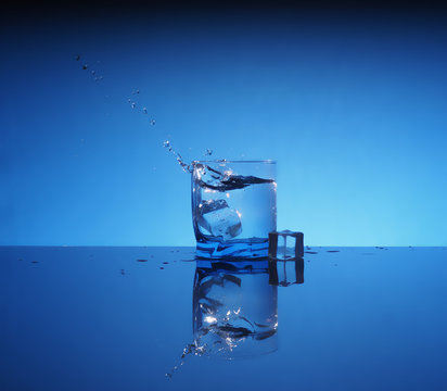 Glass of mineral clear water with ice