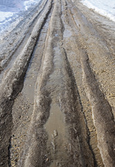Dirty country road in spring