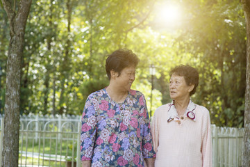 Asian elderly women morning exercise, walking at outdoor
