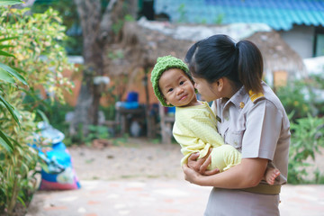 Asian Mother holding her baby
