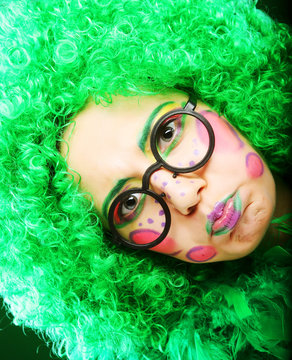 crazy woman over green background