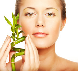  young woman with a bamboo plant