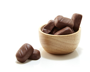 Chocolate candy in wooden bowl
