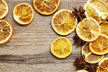 Fototapeta na wymiar Dried oranges on wooden background