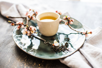 Green tea and peach blossom as a spring concept