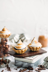 Chocolate Tartlets with nuts and Italian meringue