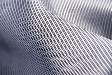 Silk background, texture of gray ribbed  shiny fabric