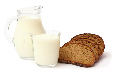Glass jug pitcher of fresh milk with glass and bread isolated on white background carafe