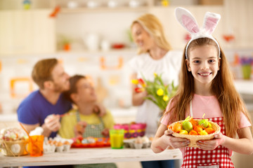 Girl show painting Easter eggs