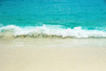 Fototapeta na wymiar Sea waves and sandy beach