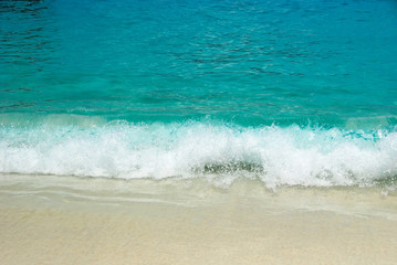 Fototapeta na wymiar Sea waves and sandy beach