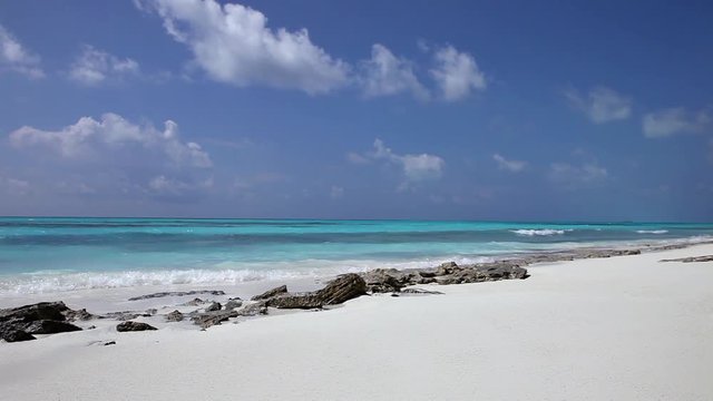 Beach at Maldives island Fulhadhoo with white sandy beach and sea